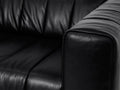 Close-up of the Portfino Vintage Black Channel tufted leather sofa showcasing its premium leather upholstery.