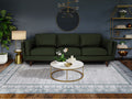 Selina Mid century Green Leather 3 Seater Sofa in contemporary living room with stylish decor.
