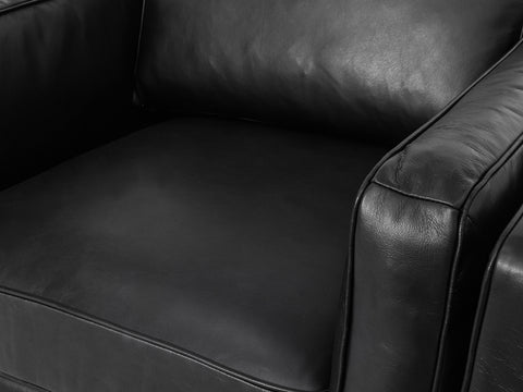 Selina Midcentury Black Leather Accent Chair with plush black leather upholstery and contemporary design.