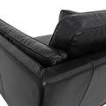Selina Midcentury Black Leather Accent Chair close-up of backrest and plush cushions.