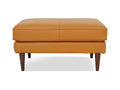 Selina Midcentury Cognac Leather Ottoman in plush cognac leather with teak oak legs, showcasing a modern yet classic style.