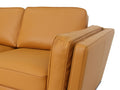 Selina Midcentury Cognac Leather Sectional Sofa close-up detail of plush seating and armrest.