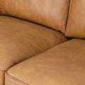 Selina Midcentury Tan Leather 3 Seater Sofa close-up of soft tan leather cushions and upholstery.