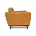 Selina Midcentury Cognac Leather Accent Chair side view showcasing its luxurious cognac leather and sleek design.