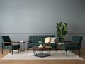 Sogno Round Wood Top Metal Caged Base Coffee Table in modern living room setup with green sofas and decor.