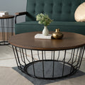 Sogno Round Wood Top Metal Caged Base Coffee Table in a modern living room setting, featuring an open metal caged base and ash veneer tabletop.