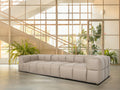 Tuscono Leather Beige 3 Seater Modular Sofa in modern interior setting with large windows and greenery.