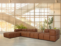 Tuscono Leather Brown 4 Seater Sectional Modular Sofa in a contemporary living space with large windows.