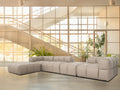 Tuscono Leather Beige 4 Seater Sectional Modular Sofa in a modern room with large windows and greenery.