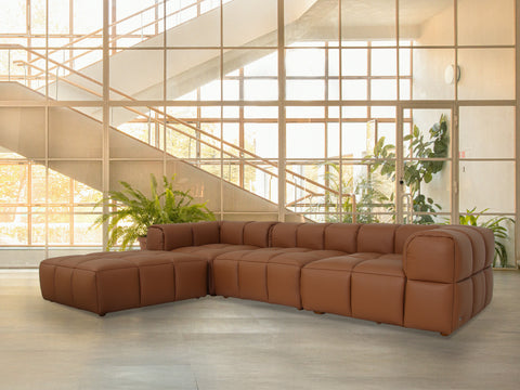 Tuscono Leather Brown 3 Seater Sectional Modular Sofa displayed in a bright, modern living space with greenery.